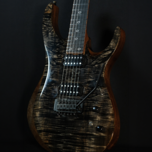Brown Striped / Natural Figured Top Guitar Closeup with black hardware and black humbuckers.